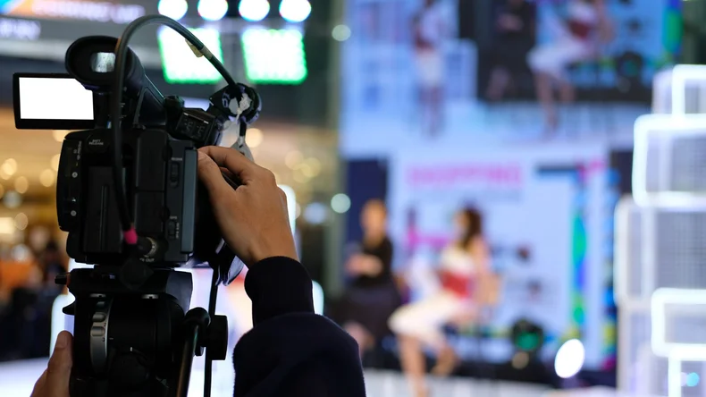 A presenter being filmed for a live streamed event