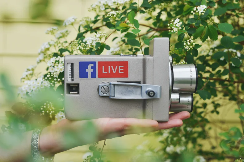 A video camera showing the Facebook Live logo.